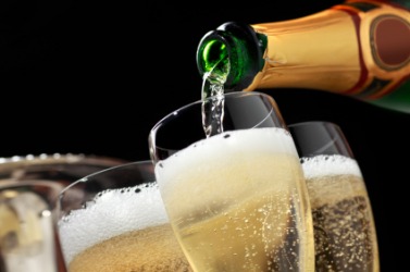 Pouring glasses of champers. Pouring glasses of champers.
