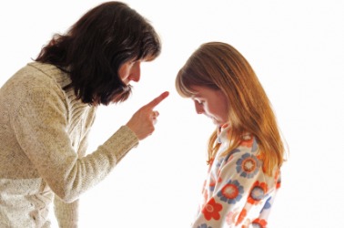 A child endures her mother's diatribe. A child endures her mother's diatribe.