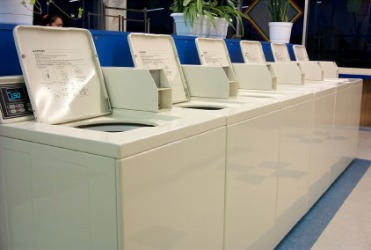 Washing machines in a launderette. Washing machines in a launderette.