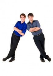 Two men leaning against each other. Two men leaning against each other.