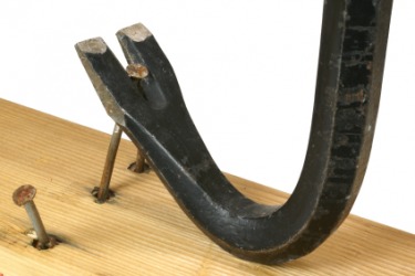 A crowbar used as a lever. A crowbar used as a lever.