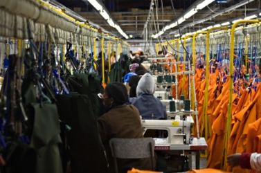 A factory engaged in the manufacture of clothing. A factory engaged in the manufacture of clothing.