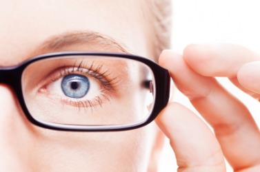 This woman wears glasses to help her see. This woman wears glasses to help her see.