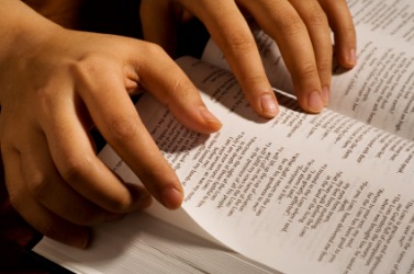 A person reading scripture. A person reading scripture.