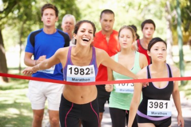 A runner achieves her goal of winning the race. A runner achieves her goal of winning the race.