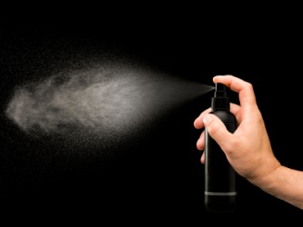 Liquid particles such as hairspray or paint being dispensed into the air. Liquid particles such as hairspray or paint being dispensed into the air.