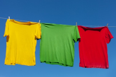 Shirts hanging on a line to air-dry. Shirts hanging on a line to air-dry.