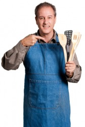 A man wearing an apron. A man wearing an apron.