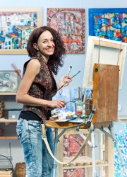 An artist at work in her studio. An artist at work in her studio.