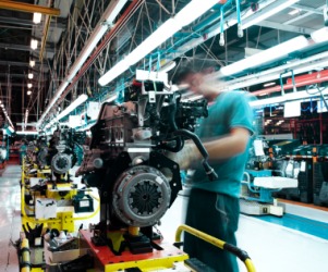 A man working on an assembly line. A man working on an assembly line.
