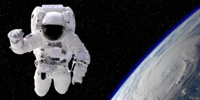 An astronaut floating in space. An astronaut floating in space.