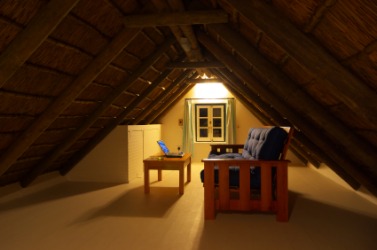 An attic being used as a workroom. An attic being used as a workroom.