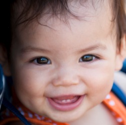 A babys smile revealing two baby teeth, or milk teeth. A babys smile revealing two baby teeth, or milk teeth.