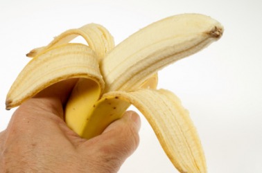 A half peeled banana. A half peeled banana.