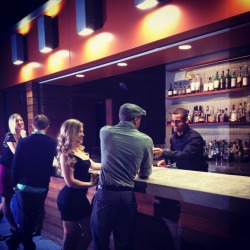 Friends enjoy having drinks at a bar. Friends enjoy having drinks at a bar.