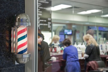 A view through the window of a barbershop. A view through the window of a barbershop.