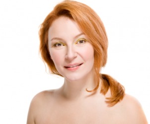 A woman with bare shoulders. A woman with bare shoulders.