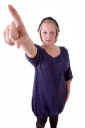 A woman telling someone to go away, or begone. A woman telling someone to go away, or begone.