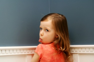 A child exhibiting bad behavior. A child exhibiting bad behavior.