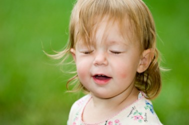 A little girl blinks. A little girl blinks.