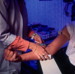 A nurse draws blood for a blood test. A nurse draws blood for a blood test.