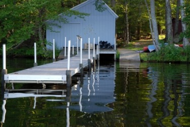 A boathouse on a lake. A boathouse on a lake.