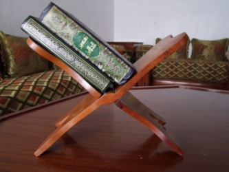 A bookrest, or bookstand, holding books. A bookrest, or bookstand, holding books.