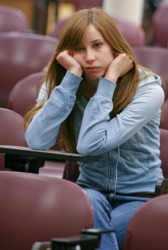 This girl is experiencing boredom. This girl is experiencing boredom.