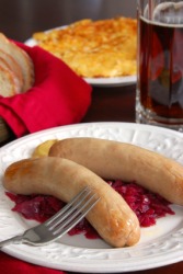 Bratwurst served with red cabbage. Bratwurst served with red cabbage.