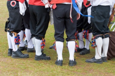 A group of men in knee breeches. A group of men in knee breeches.