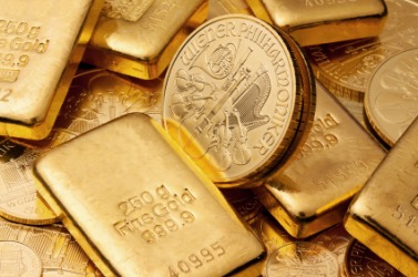 Gold bullion in the form of bars and coins. Gold bullion in the form of bars and coins.