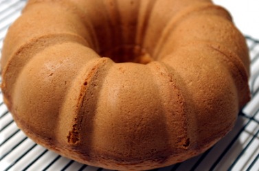 A cake that has been baked in a bundt pan. A cake that has been baked in a bundt pan.