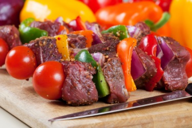 Shish kebab on a cutting board. Shish kebab on a cutting board.