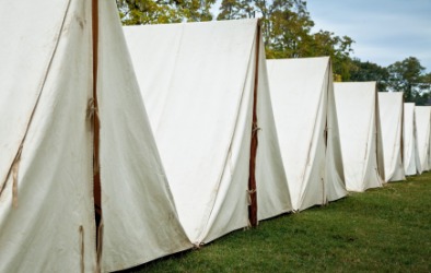 Tents in a re-enactment of a Revolutionary War soldiers camp. Tents in a re-enactment of a Revolutionary War soldiers camp.