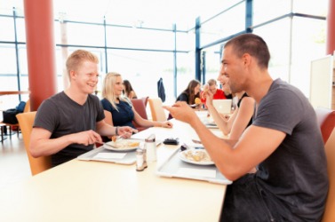 Students eating in the school canteen. Students eating in the school canteen.