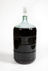 A carboy filled with fermenting wine. A carboy filled with fermenting wine.