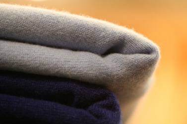 A stack of cashmere sweaters. A stack of cashmere sweaters.