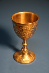 An ornate gold chalice. An ornate gold chalice.