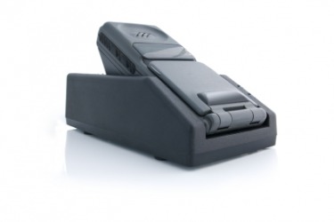 A cellphone sitting on its charger. A cellphone sitting on its charger.