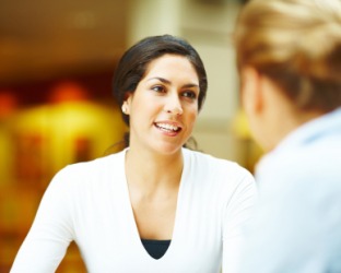 A woman having a chat with her friend. A woman having a chat with her friend.