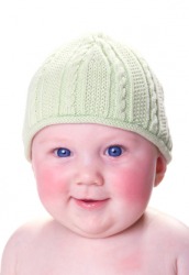 A baby with bright pink cheeks. A baby with bright pink cheeks.