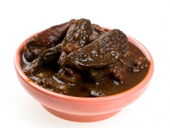 A bowl of chipotle chilis. A bowl of chipotle chilis.