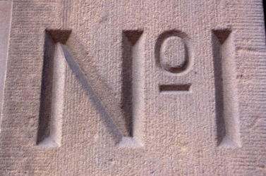 Letters chiseled into a piece of stone. Letters chiseled into a piece of stone.