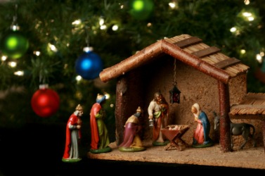 Figures depicting the birth of Christ under a Christmas tree. Figures depicting the birth of Christ under a Christmas tree.