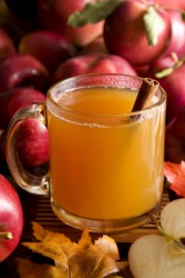 A cup of hot apple cider. A cup of hot apple cider.