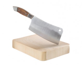 A meat cleaver stuck in a cutting board. A meat cleaver stuck in a cutting board.