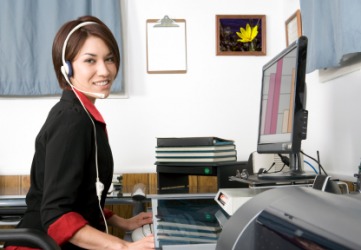 An office clerk working at her desk. An office clerk working at her desk.