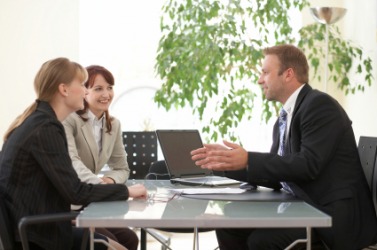 A salesman with two clients. A salesman with two clients.
