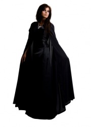 A woman wearing a long black cloak. A woman wearing a long black cloak.