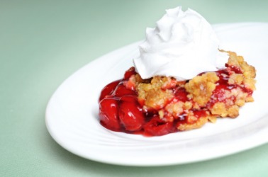 Cherry cobbler with whipped cream. Cherry cobbler with whipped cream.